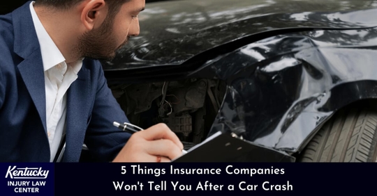 insurance adjuster checking car after an accident
