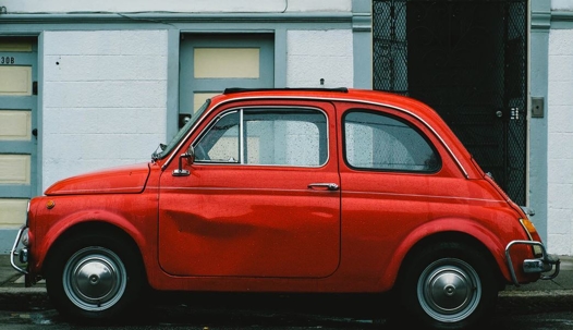 Red car with dented door